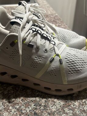 On Running women’s grey Cloudnova with Neon Yellow Accents